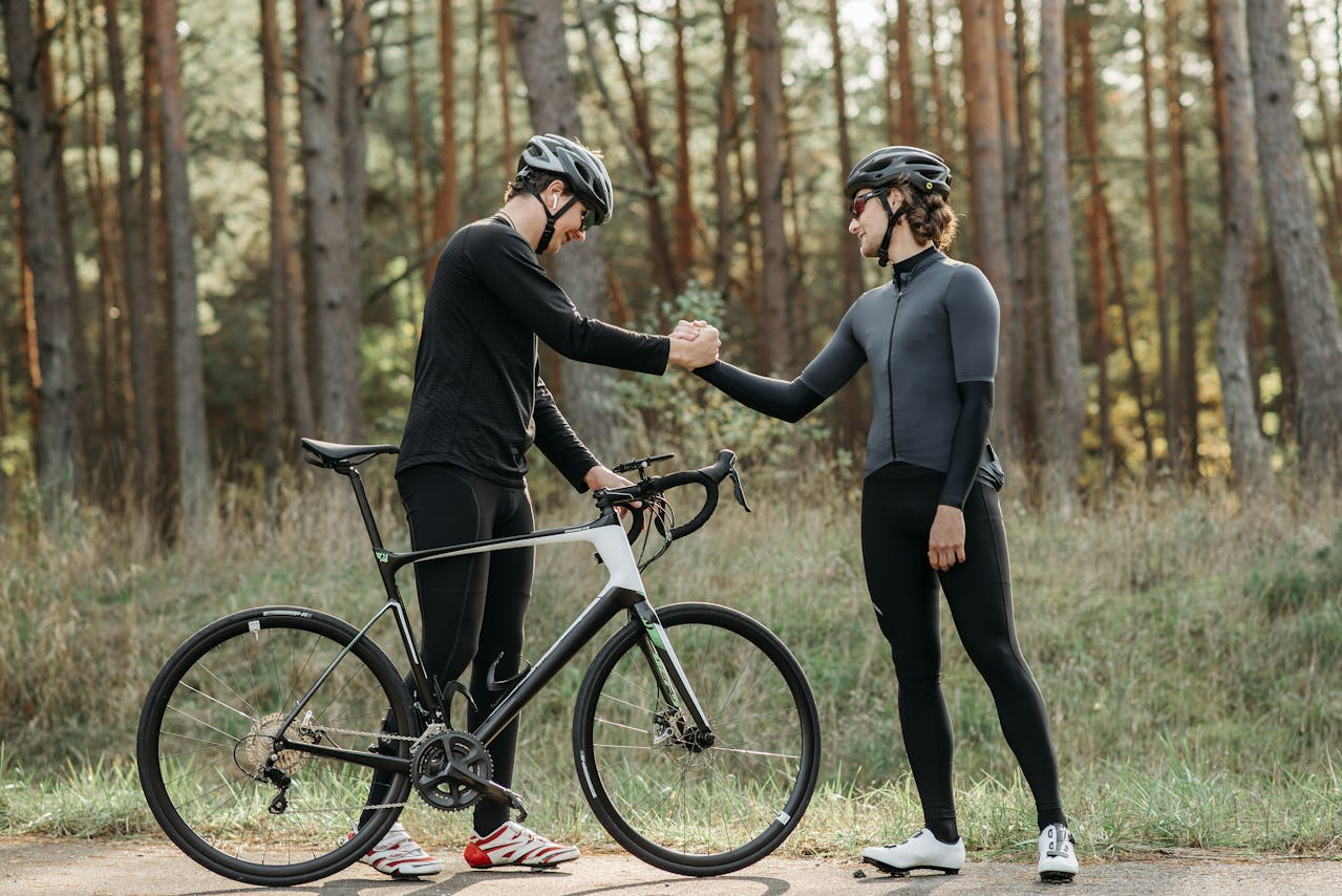 Two bikers greeting one another
