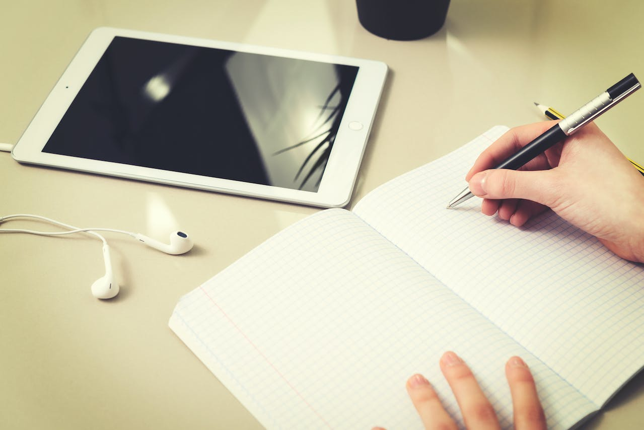 a person taking down notes