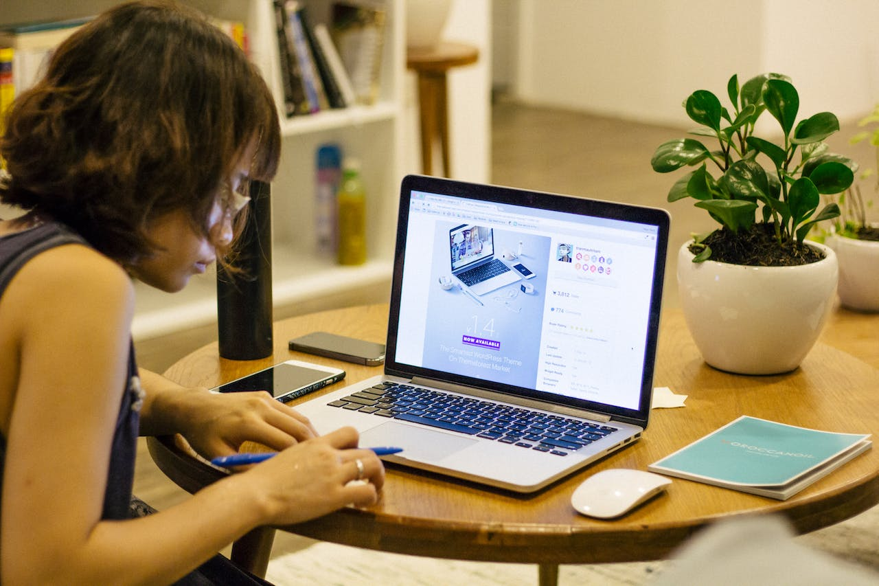 a woman taking time to learn from her laptop